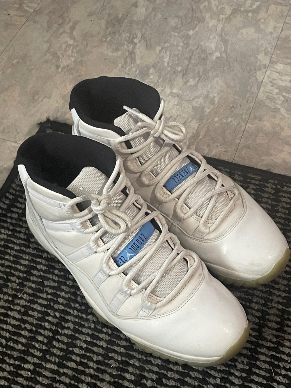 Jordan Men’s White High-Top Sneakers with Black Collar and Blue Tongue Tag